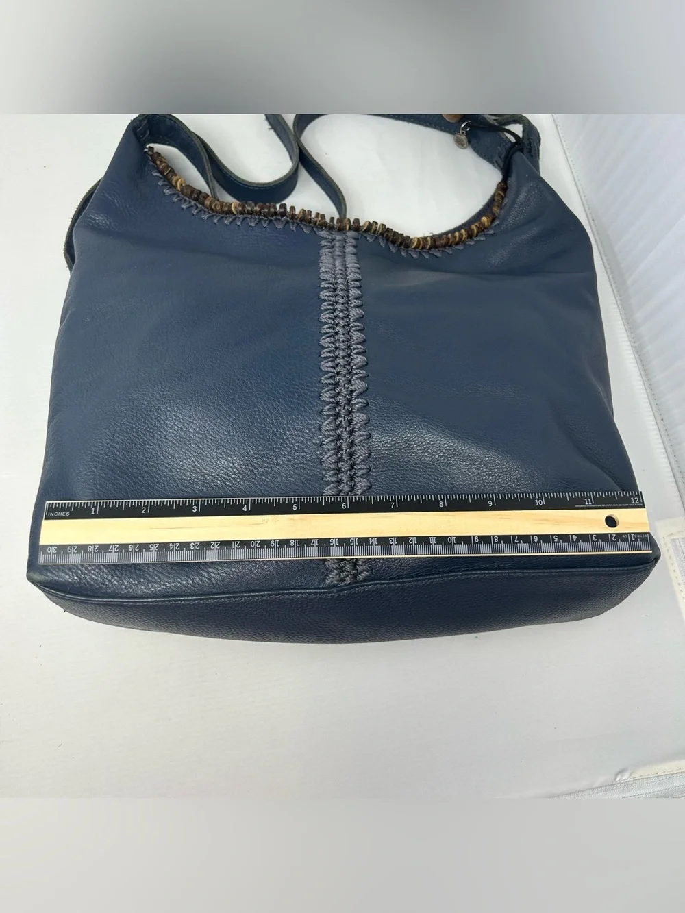 The Sak Boho Leather Hobo Bag slouchy with Beaded Trim and Tassel charm Blue